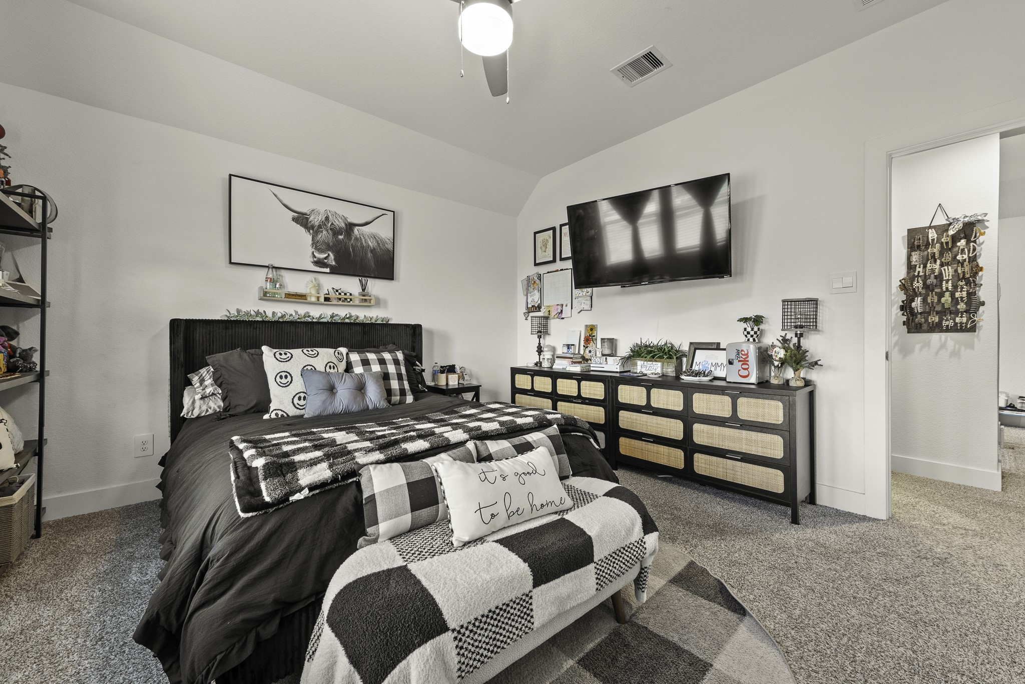 10009 Gray Jay Court Conroe, TX 77384 - Photo 29 of 47 a bedroom with furniture and a flat screen tv