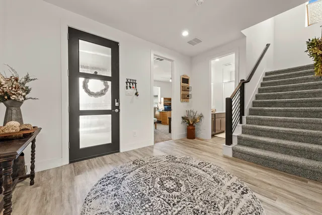 a bedroom with two beds and a large window