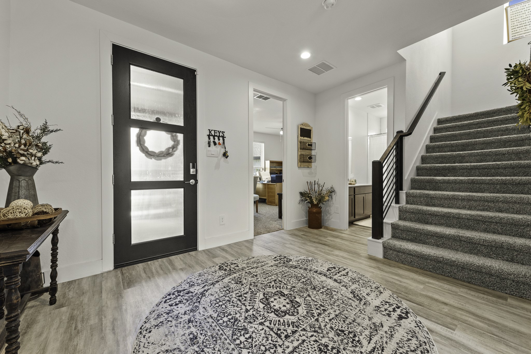 10009 Gray Jay Court Conroe, TX 77384 - Photo 3 of 47 a view of a livingroom with wooden floor and a window