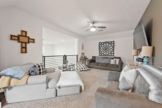 a bedroom with furniture and a large window