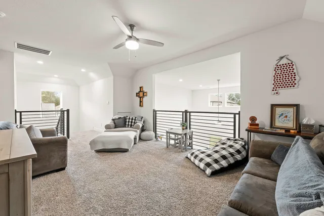 a view of a workspace with furniture and wooden floor