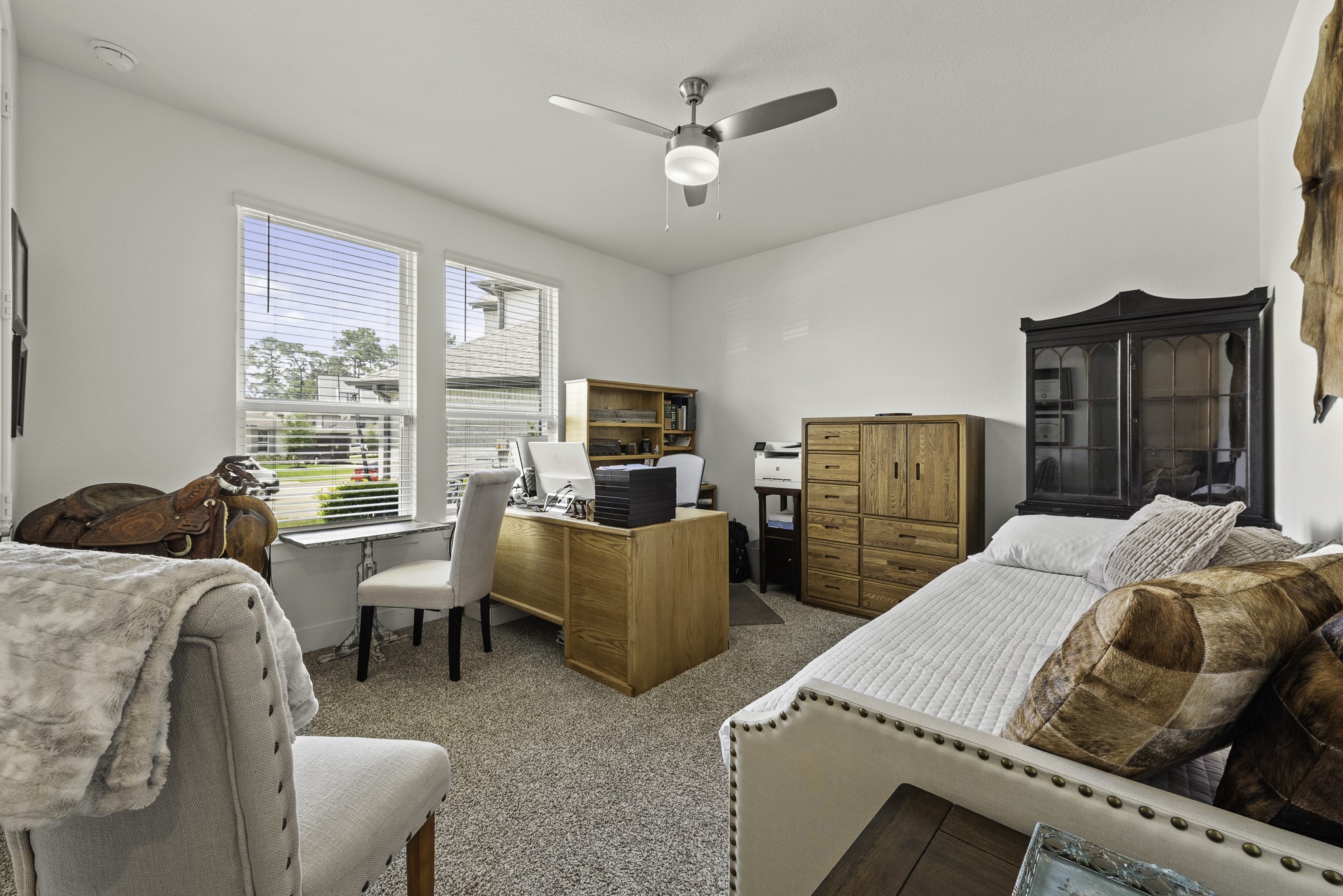 10009 Gray Jay Court Conroe, TX 77384 - Photo 4 of 47 a bedroom with two beds and a large window