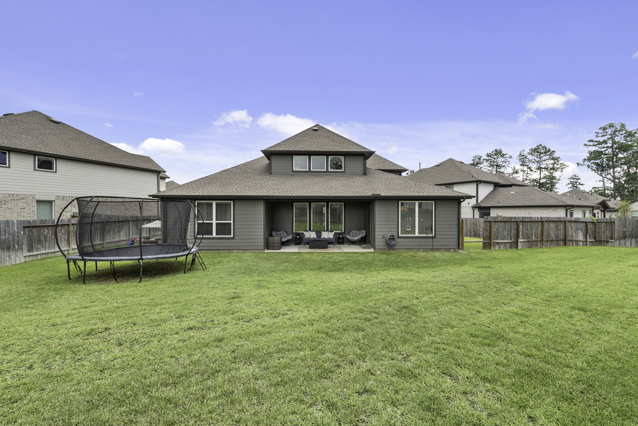 10009 Gray Jay Court Conroe, TX 77384 - Photo 41 of 47 a view of a house with a yard porch and sitting area