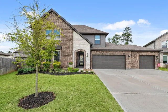 an aerial view of a house with a swimming pool