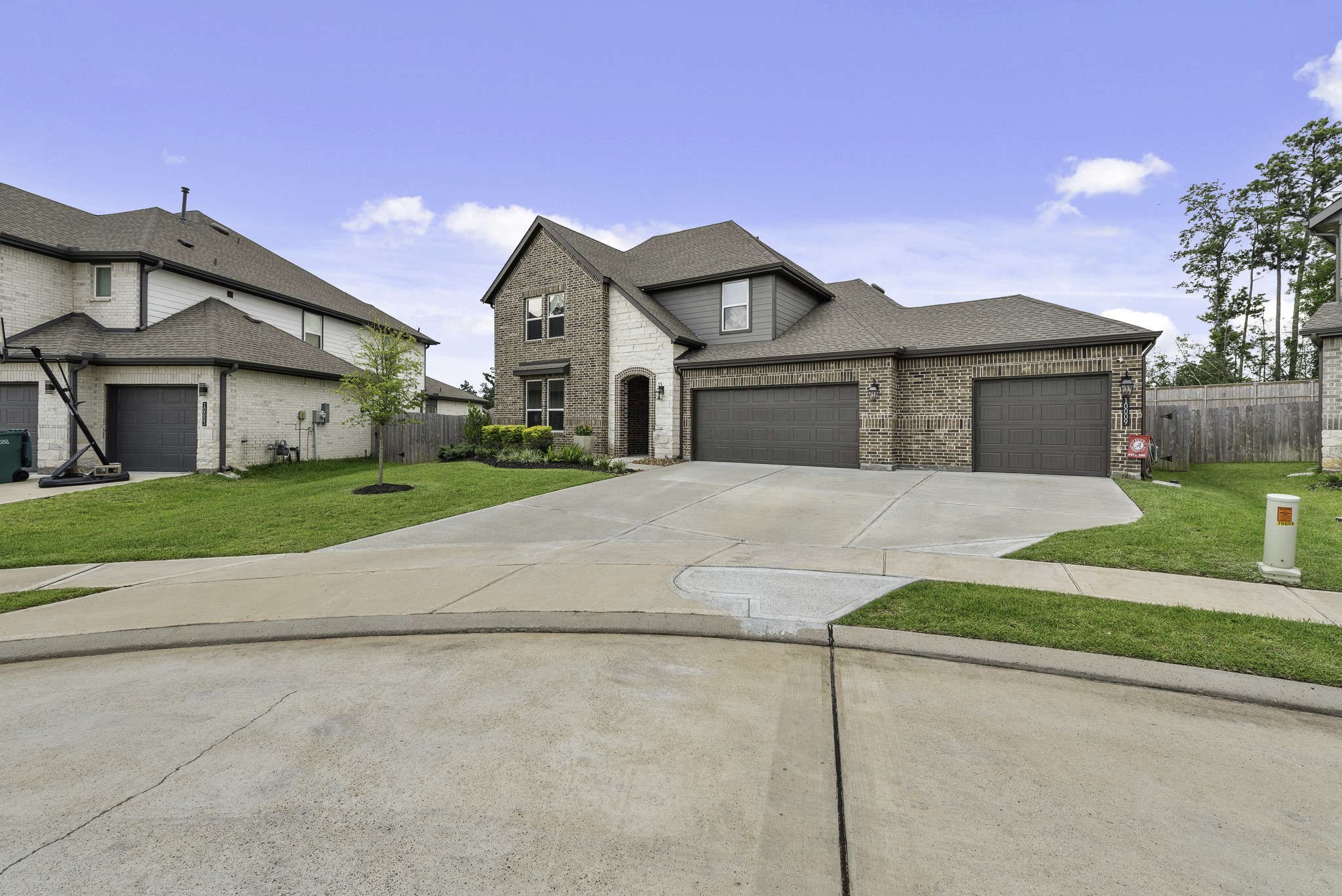 10009 Gray Jay Court Conroe, TX 77384 - Photo 45 of 47 a front view of a house with a yard and garage