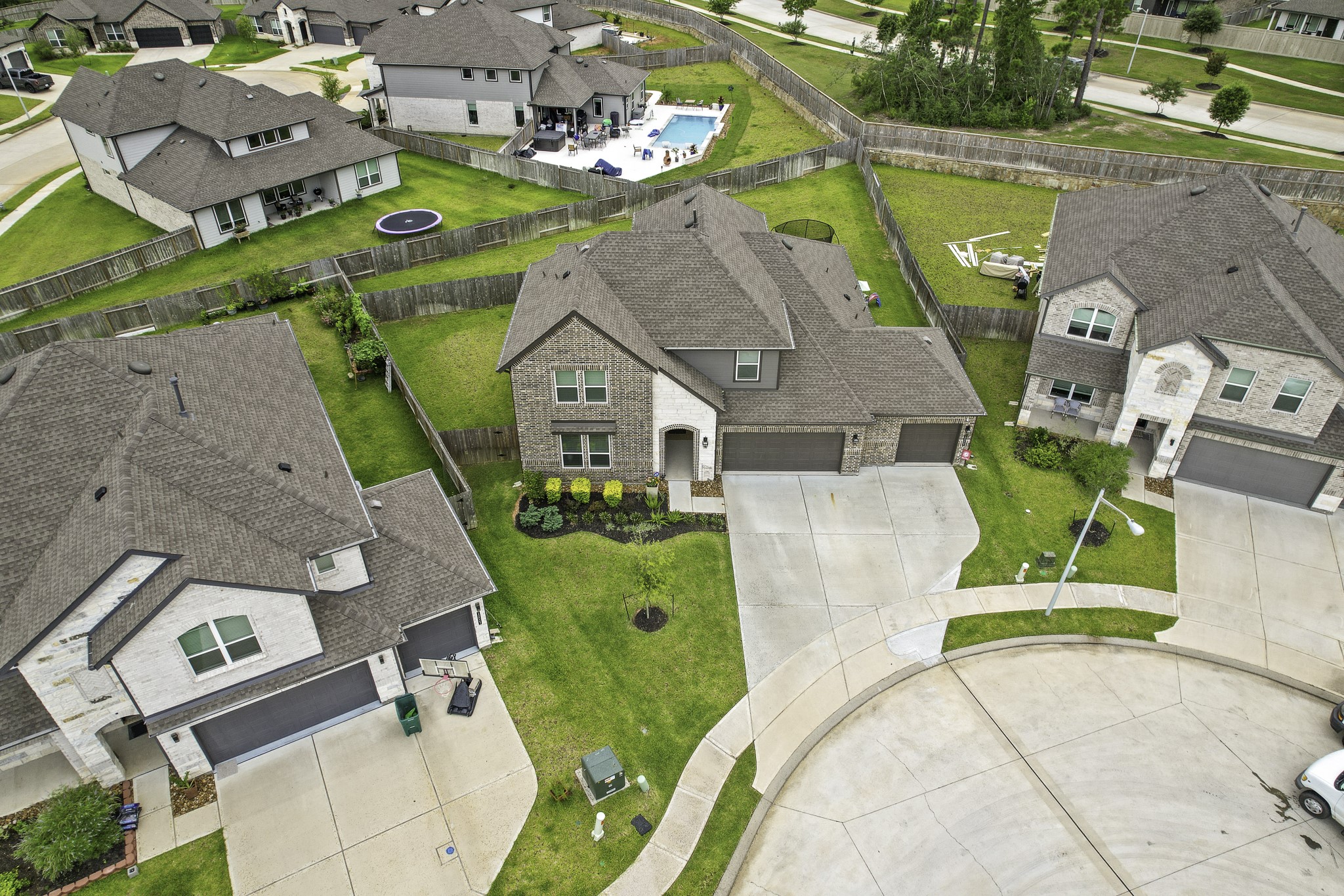 10009 Gray Jay Court Conroe, TX 77384 - Photo 47 of 47 an aerial view of a house with a swimming pool