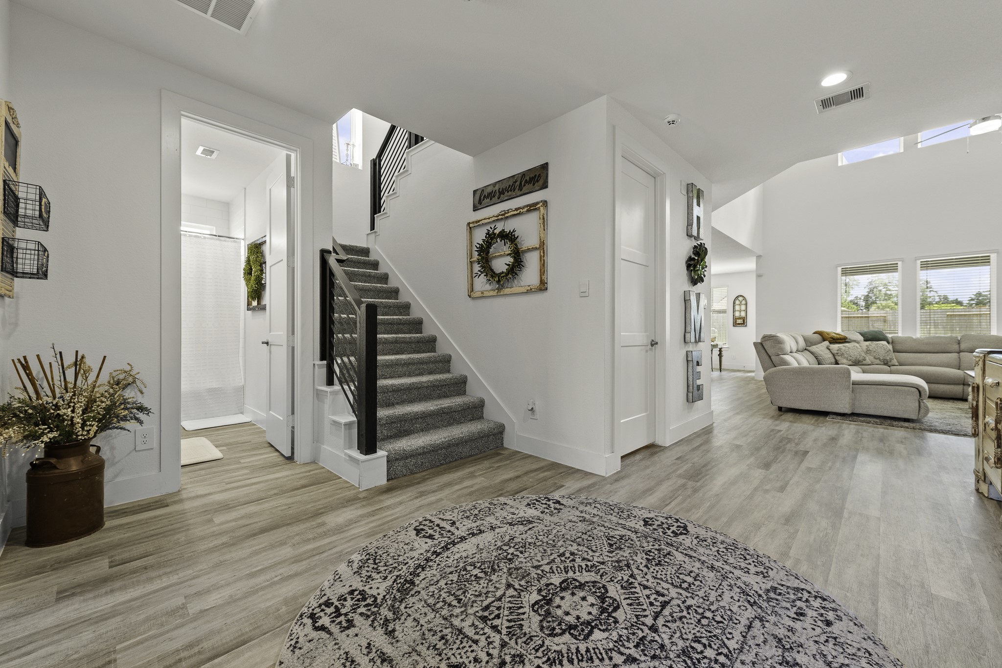 10009 Gray Jay Court Conroe, TX 77384 - Photo 5 of 47 a view of entryway and hall with wooden floor
