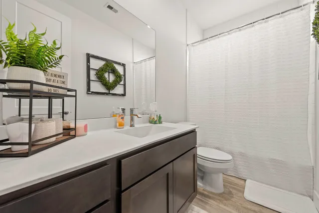 a view of a livingroom with furniture and wooden floor