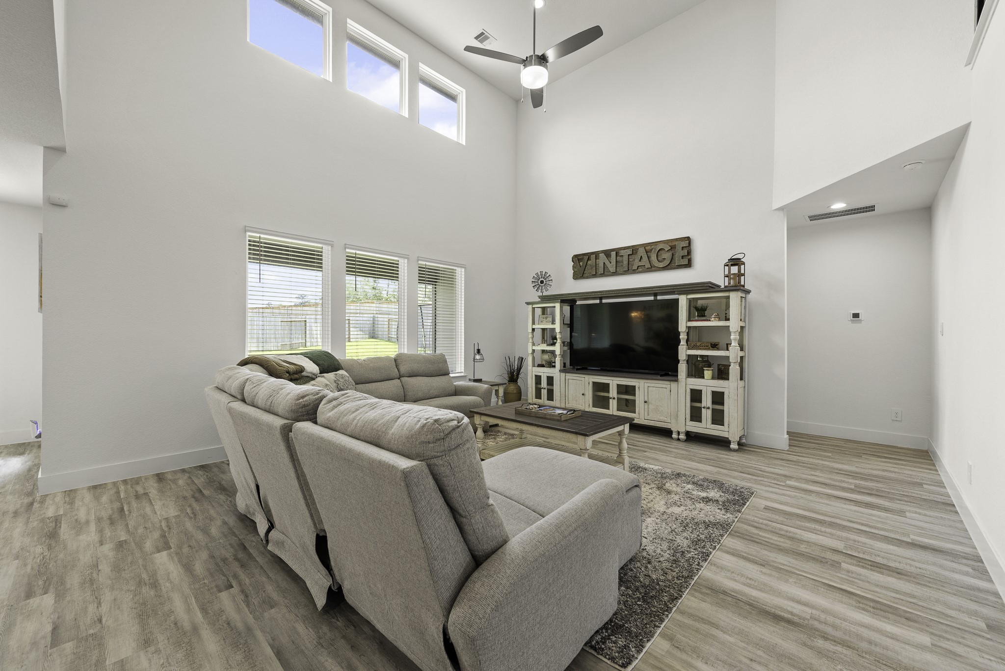 10009 Gray Jay Court Conroe, TX 77384 - Photo 8 of 47 a living room with furniture and a flat screen tv