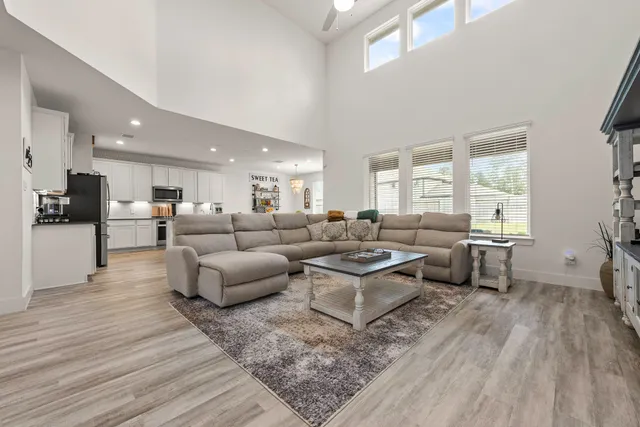 a kitchen with appliances a sink a counter top space and cabinets