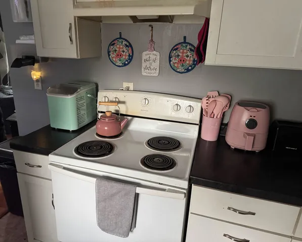 a kitchen with a stove and a microwave