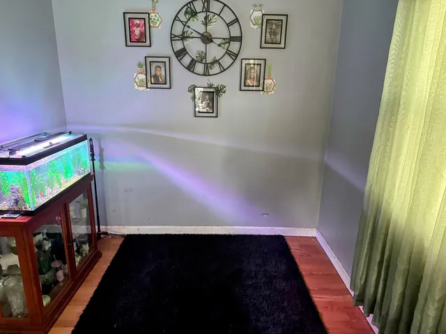 a view of a entryway door with wooden floor