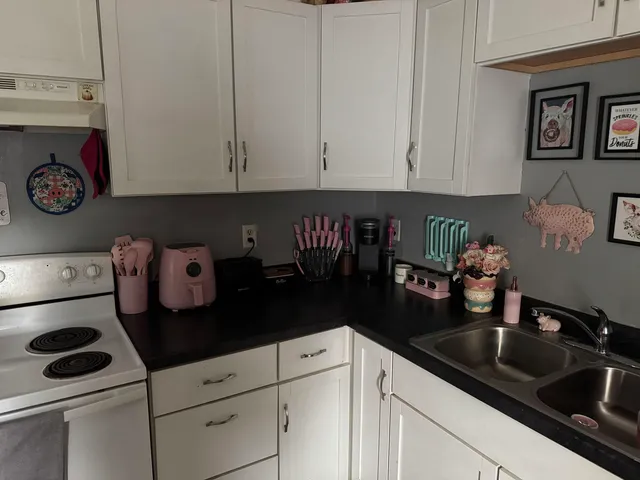 a kitchen with a sink and cabinets