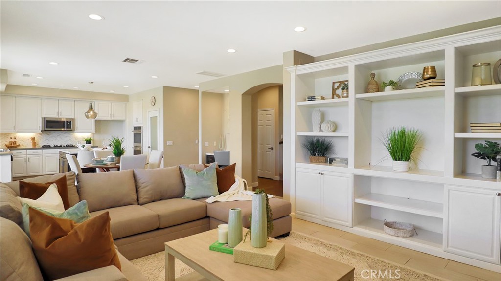 3759 Dewcrest Court Chino, CA 91710 - Photo 11 of 45 a living room with furniture and a kitchen view