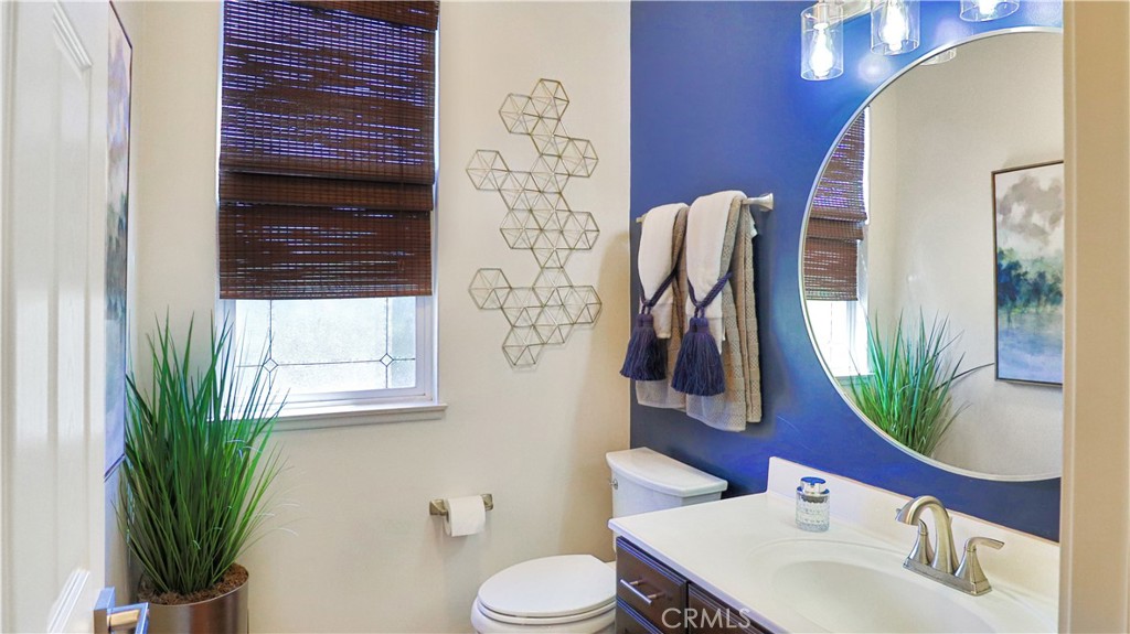 3759 Dewcrest Court Chino, CA 91710 - Photo 17 of 45 a bathroom with a toilet sink and mirror