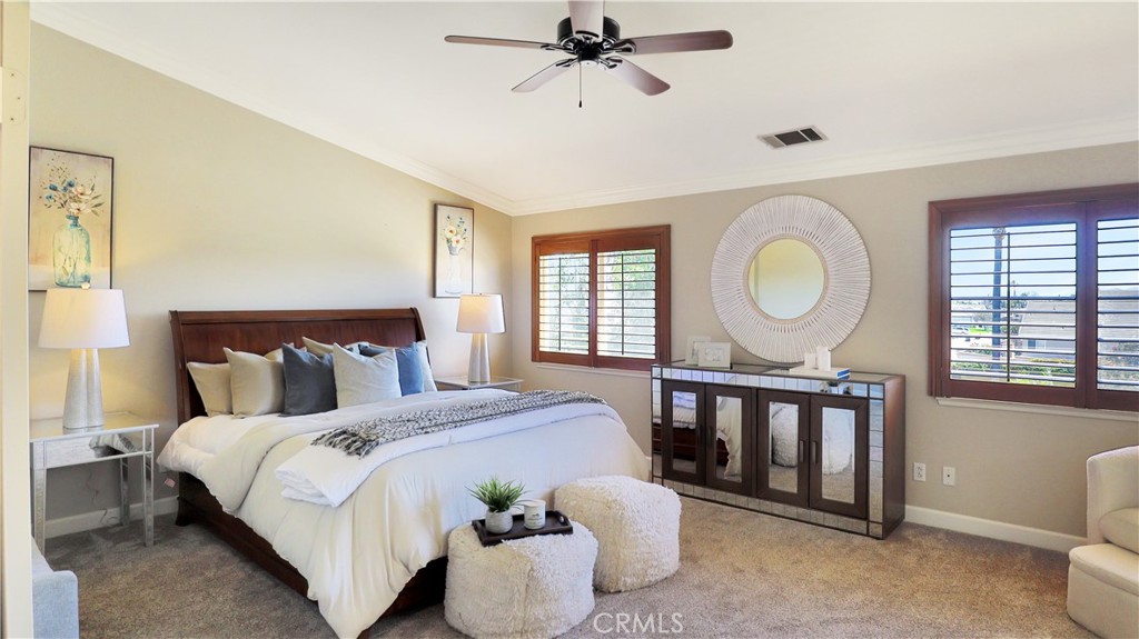 3759 Dewcrest Court Chino, CA 91710 - Photo 25 of 45 a bedroom with a bed lamps and a large mirror