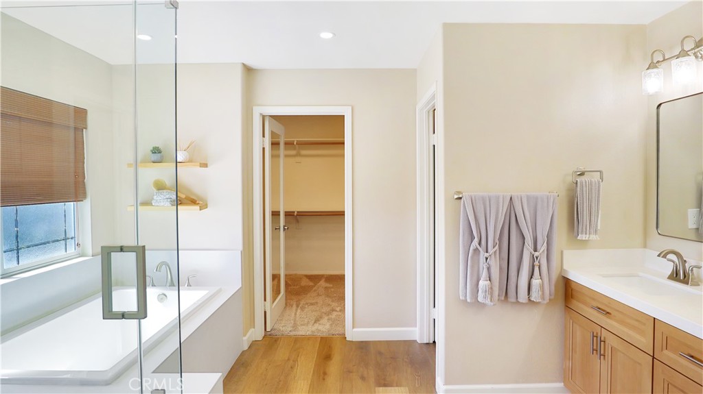3759 Dewcrest Court Chino, CA 91710 - Photo 28 of 45 a bathroom with a tub sink and mirror