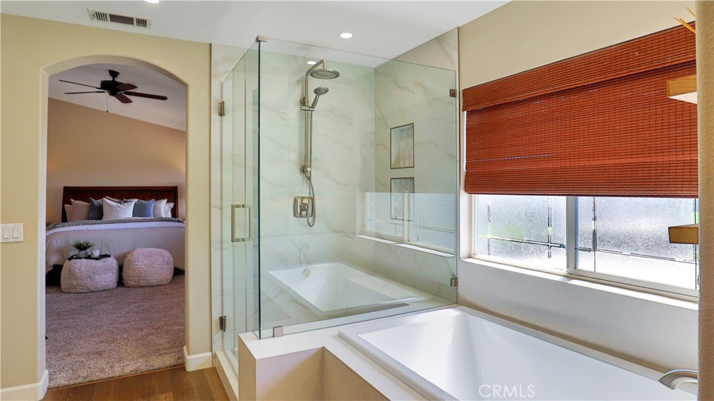 3759 Dewcrest Court Chino, CA 91710 - Photo 29 of 45 a bathroom with a tub and a shower