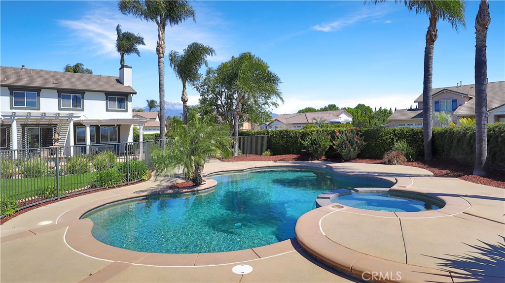3759 Dewcrest Court Chino, CA 91710 - Photo 4 of 45 a view of a swimming pool with a garden