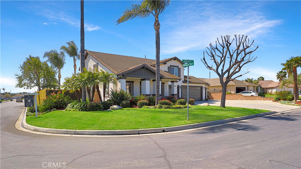 3759 Dewcrest Court Chino, CA 91710 - Photo 43 of 45 a view of a white house with a big yard and potted plants