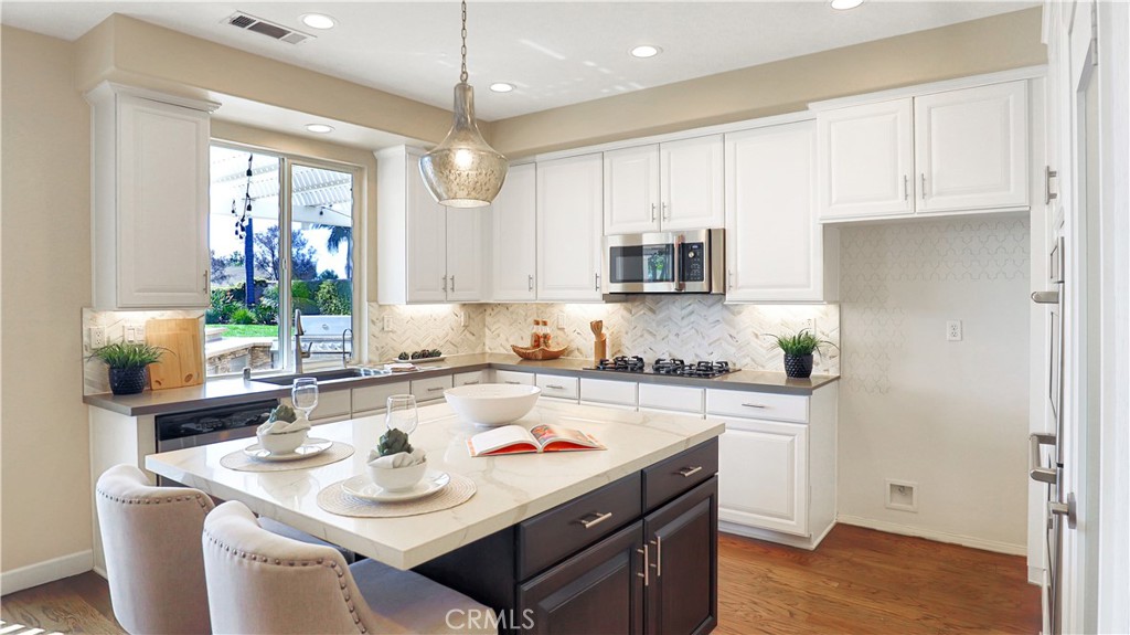 3759 Dewcrest Court Chino, CA 91710 - Photo 6 of 45 a kitchen with a sink a stove and cabinets