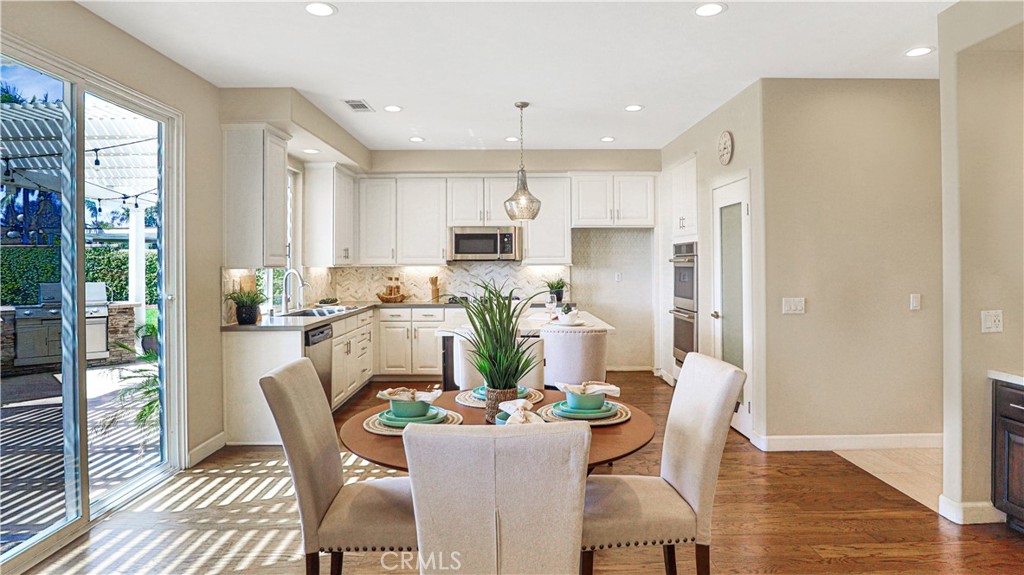 3759 Dewcrest Court Chino, CA 91710 - Photo 8 of 45 a dining room with furniture a window and wooden floor