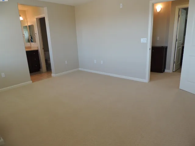 an empty room with a mirror