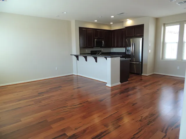 a view of kitchen with wooden floor