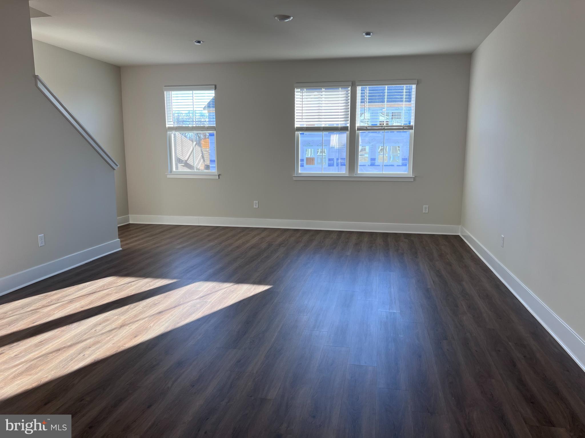 152 Munsee Circle Winchester, VA 22602 - Photo 5 of 19 a view of an empty room with wooden floor and a window