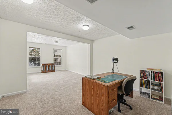 a room with furniture and air hockey table