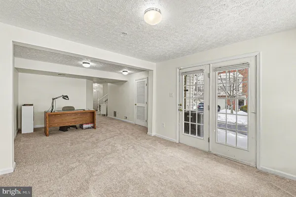 a big room with closet and windows