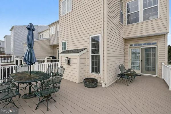 a view of a chairs and table on the deck
