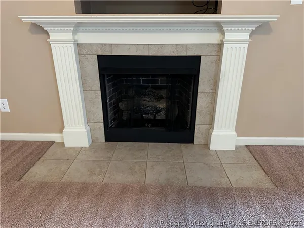 a living room with a fireplace