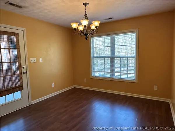 a view of livingroom with window and wooden floor