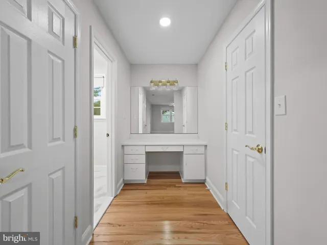 a view of an entryway with wooden floor
