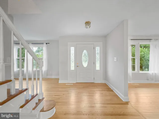 a view of livingroom with furniture wooden floor and windows