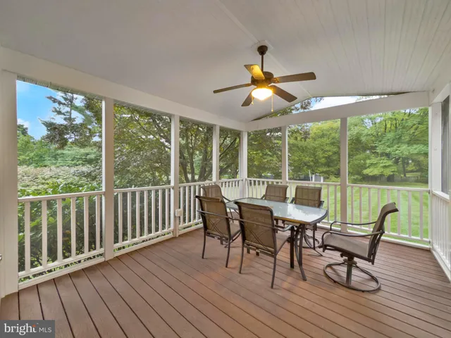 a dining room with furniture window and wooden floor