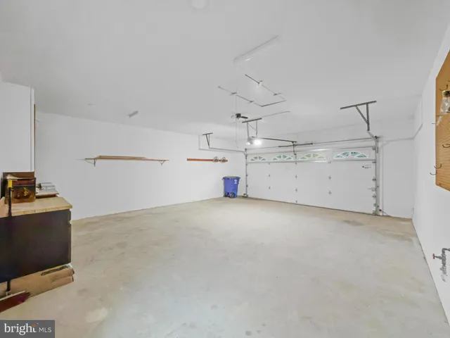 a view of a storage & utility room with cabinets