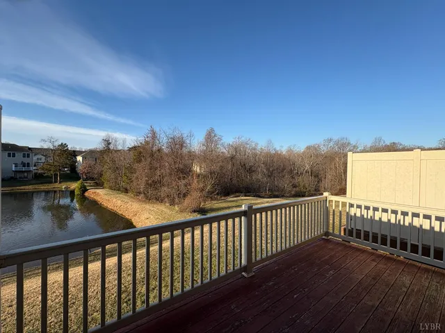 a view of balcony with wooden floor