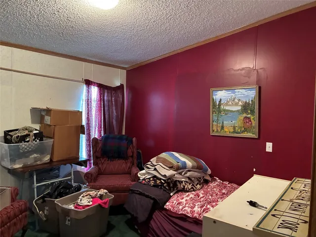 a bedroom with a bed and a table