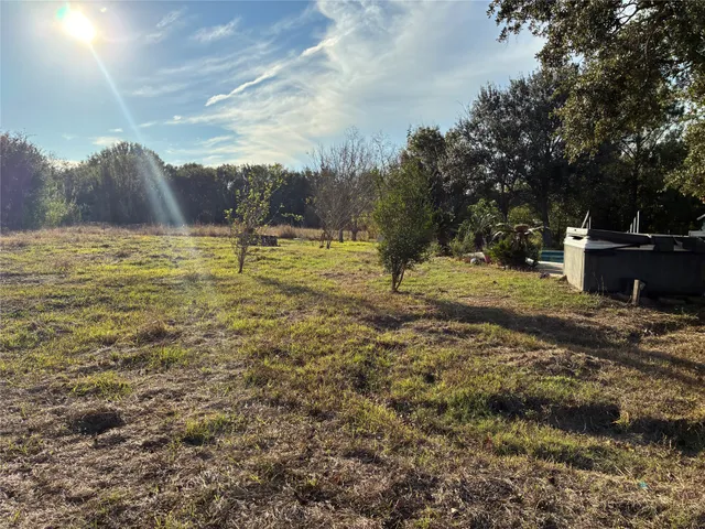 a view of a yard with an outdoor space