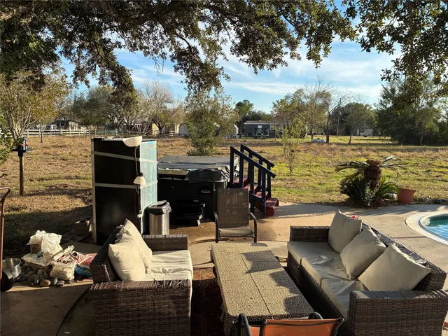 a view of a roof deck with couches table and chairs