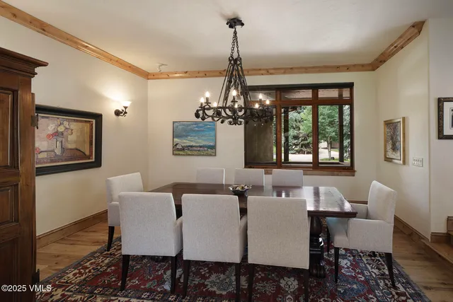 a living room with furniture and a lamp