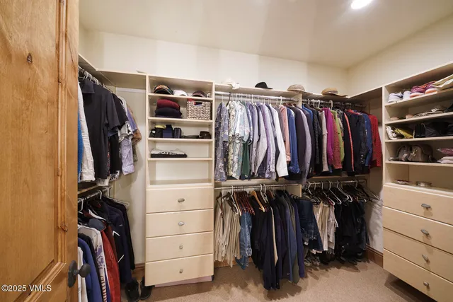 a view of a park with trees in the background