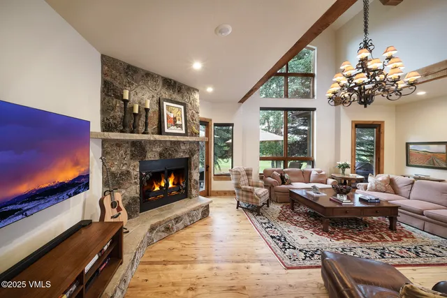 a kitchen with stainless steel appliances granite countertop a stove a sink dishwasher and cabinets with wooden floor