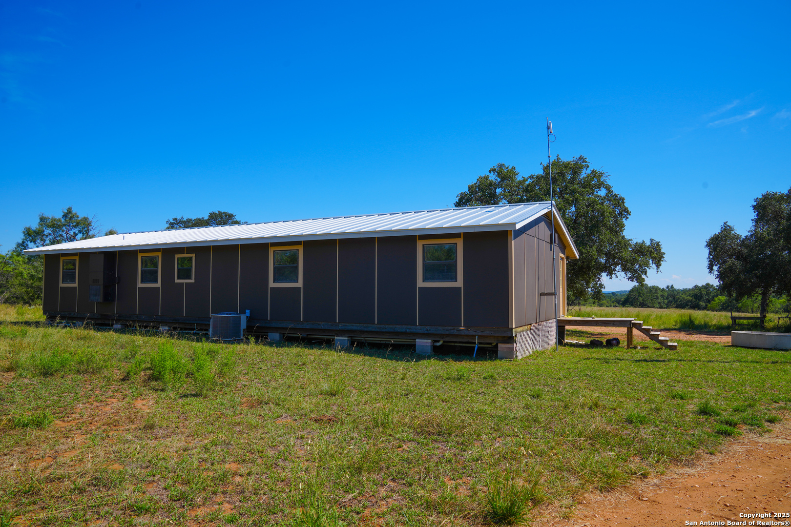 5077 Old Pontotoc Road Mason, TX 76856 - Photo 24 of 41 a view of a house with a yard