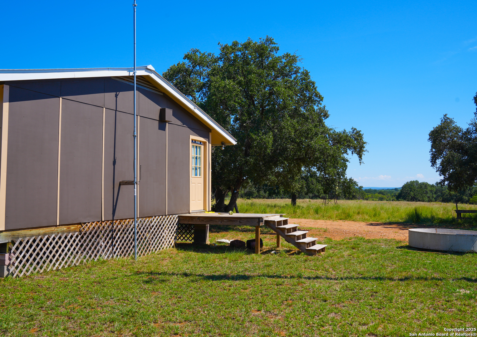 5077 Old Pontotoc Road Mason, TX 76856 - Photo 25 of 41 a backyard of a house with lots of green space