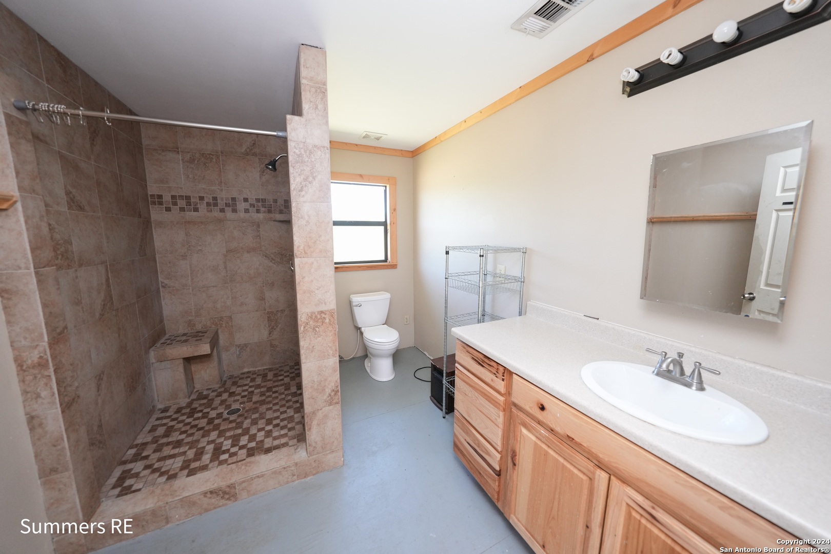5077 Old Pontotoc Road Mason, TX 76856 - Photo 28 of 41 a spacious bathroom with a sink toilet and shower