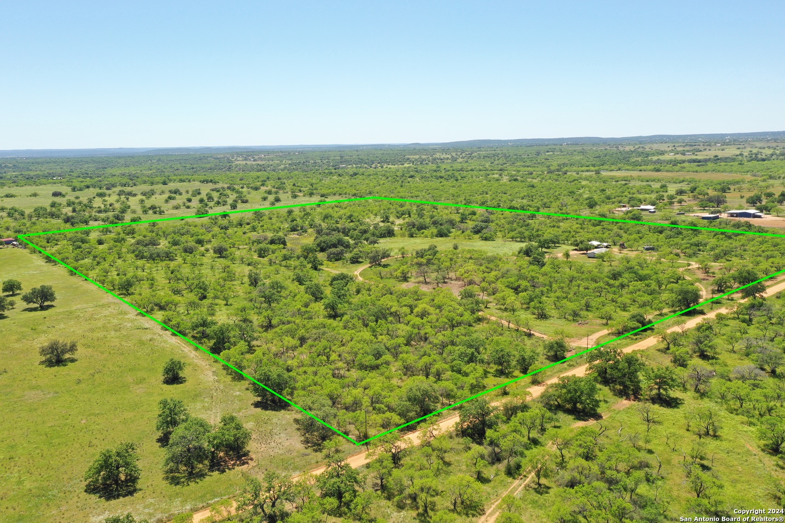 5077 Old Pontotoc Road Mason, TX 76856 - Photo 39 of 41 an aerial view of residential houses with outdoor space