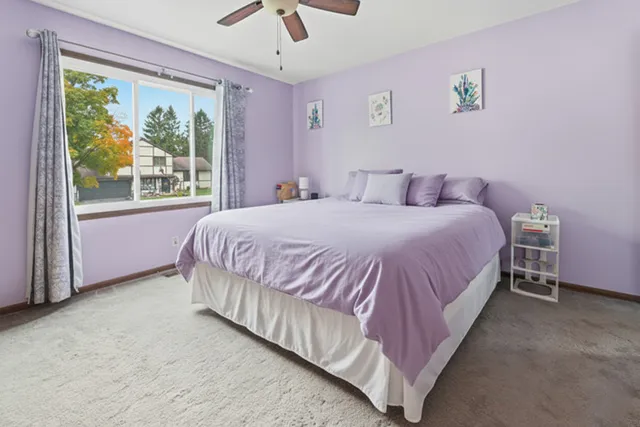 a bedroom with a large bed and a window